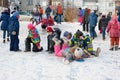 Children ride with icy mountain