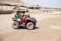 Children ride on quad bike Desert