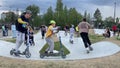 Children ride a scooter, skateboard in a skatepark. 14.09.23 Novosibirsk, Russia