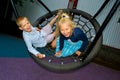 Children ride on a swing Royalty Free Stock Photo