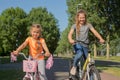 Children ride their bicycles on the bike path Royalty Free Stock Photo