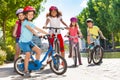 Children riding bicycles during summer vacation Royalty Free Stock Photo