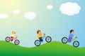 Children riding a bike two boys a girl in the sun