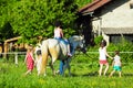 Children riding horse