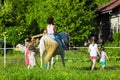 Children riding horse