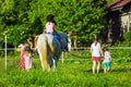 Children riding horse