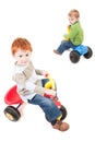 Children riding kids boys tricycles Royalty Free Stock Photo