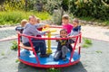 Children riding roundabout