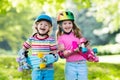 Children riding skateboard in summer park Royalty Free Stock Photo