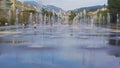 Children romping in fountain at Promenade du Paillon in Nice, summer holidays