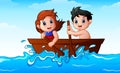 Children rowing a boat in the ocean Royalty Free Stock Photo