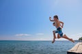 Children run, jump high into water Royalty Free Stock Photo