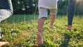 children run in the park. bare feet close-up group of children running on green grass in summer. happy family kid dream Royalty Free Stock Photo