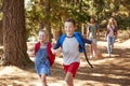 Children Running Ahead Of Parents On Family Hiking Adventure Royalty Free Stock Photo