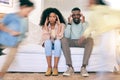 Children, running and tired parents on sofa with motion blur for energy, playing and hyper kids in living room. Black Royalty Free Stock Photo