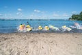 Children rushing into water with paddle boards developing water confidence and skills Royalty Free Stock Photo