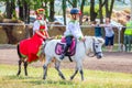 Children in Russian national costumes sit on a pony Royalty Free Stock Photo