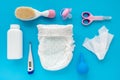 Children`s accessories and cosmetics on a blue background, flat lay, top view, layout. The concept of hygiene of the baby. A set