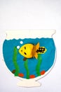 Children`s application. yellow fish in an aquarium with algae and blue water. vertical. copy space Royalty Free Stock Photo