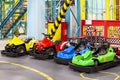 Children`s attraction with colorful electric cars.