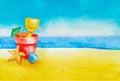 Children`s beach toys bucket, spade, umbrella, shell and starfish in the sand against sky, ocean or sea in background as concept Royalty Free Stock Photo