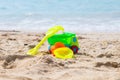 Children`s beach toys - buckets, spade, machine, car and shovel on sand on a sunny day. Royalty Free Stock Photo