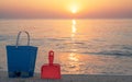 Children`s beach toys - buckets, spade and shovel on sand on a sunny day Royalty Free Stock Photo