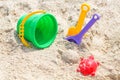 Children`s beach toys - buckets, spade and shovel on sand on a sunny day Royalty Free Stock Photo