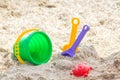 Children`s beach toys - buckets, spade and shovel on sand on a sunny day Royalty Free Stock Photo