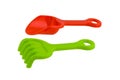 Children`s beach toys, Red spade and Green rake isolated on whit Royalty Free Stock Photo