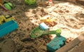 Children`s beach toys on sandbox