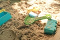 Children`s beach toys on sandbox