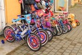 Children's bicycles stand at shop