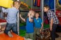 Children`s birthday celebration in the gaming complex. Group of kids having fun at playground. Royalty Free Stock Photo