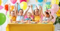 Children`s birthday. happy kids with cake