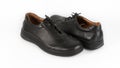 Children`s black orthopedic shoes on a white background