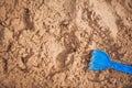 Children`s blue toy on the sand and copy space... Royalty Free Stock Photo