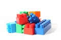 Children`s bright toys in the form of blocks lie in one heap for construction.