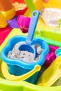 A children's bucket full of sand with a shovel stuck in the sand Royalty Free Stock Photo