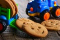 Childrens butter cookies and vehicle toy Royalty Free Stock Photo