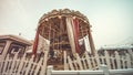 Children`s Carousel at an amusement park in the evening and night illumination. amusement park at night. Outdoor vintage colorful