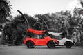 Children`s cars parked together with red-black and white photography Royalty Free Stock Photo