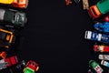 Children`s cars toys for developing baby games on a black background Royalty Free Stock Photo