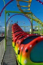 A caterpillar Roller coaster ride with no children on Royalty Free Stock Photo