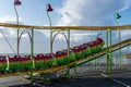 A children`s caterpillar roller coaster ride at the fairground or amusement park with nobody on it Royalty Free Stock Photo