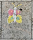 Children`s chalk drawing on a textured wall