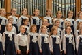 Children`s choir and soloists on stage before the start of the performance.