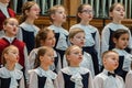 Children`s choir and soloists on stage before the start of the performance.