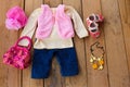 Children's clothing and accessories: vest, jeans, jacket, shoes, hat and handbag Royalty Free Stock Photo