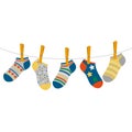 Children`s colored socks hang on a rope. concept of international day of children with down syndrome and premature babies